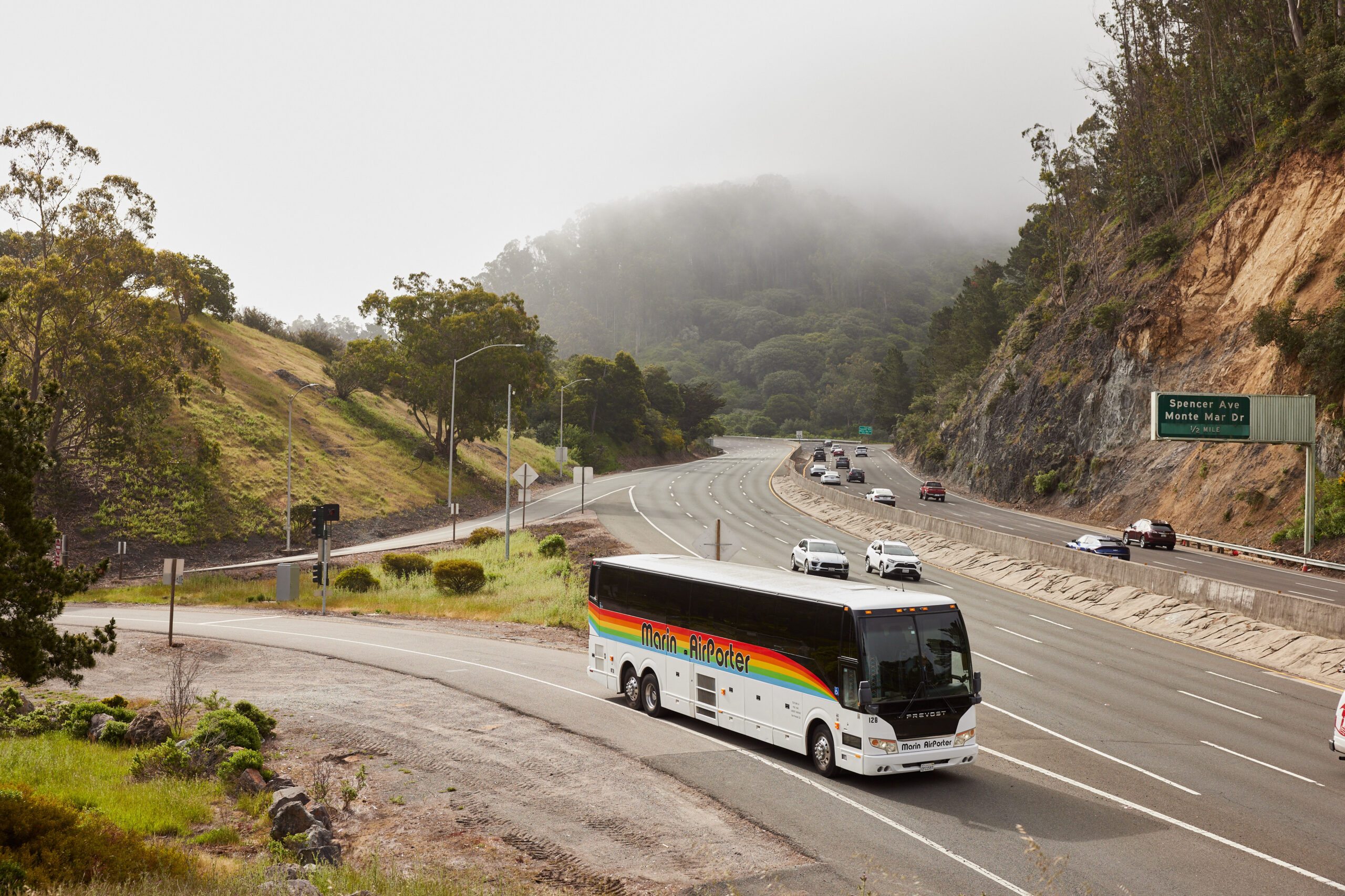 Marin Airporter bus entering the highway on a misty day near the Spencer Avenue exit.